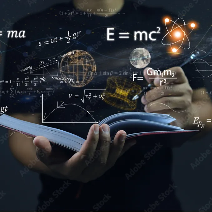 formulas with person writing in notebook